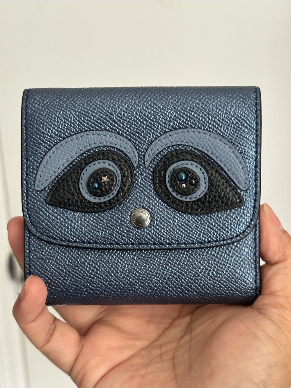 Coach Small Snap Wallet featuring a bear motif